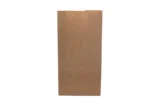 "A single brown paper bag stands upright against a light background."