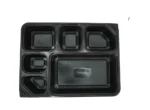 "Elegant black plastic container with multiple compartments, perfect for meal segmentation from www.jcpackagingdubai.com."