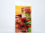 "Colorful PP coated chicken bag featuring delicious snack images, available at JC Packaging Dubai, ideal for preserving the flavor and freshness of your meals."